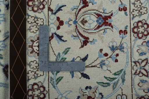 Backside of handmade New Nain rug showing knot structure and weave density