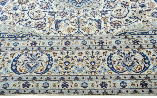 Corner detail of 2000s Nain rug showing border pattern and Wool pile