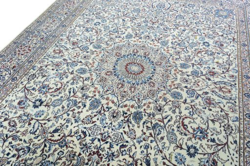 Backside of handmade New Nain rug showing knot structure and weave density