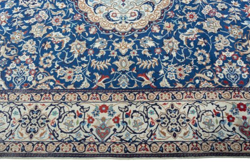 Corner detail of 2000s Nain rug showing border pattern and Wool pile