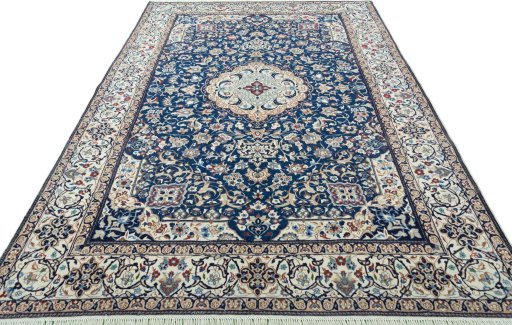 Surface texture of 2000s Nain rug with natural Wool and intricate pattern