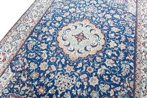 Backside of handmade 2000s Nain rug showing knot structure and weave density