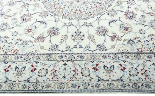 Corner detail of 2000s Nain rug showing border pattern and Wool pile