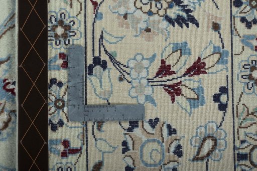 Backside of handmade 2000s Nain rug showing knot structure and weave density