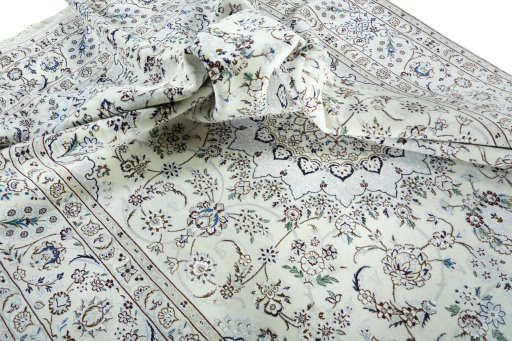 Surface texture of 2000s Nain rug with natural Wool and intricate pattern
