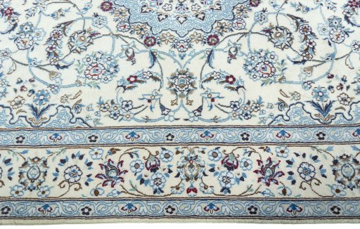 Corner detail of 2000s Nain rug showing border pattern and Wool pile
