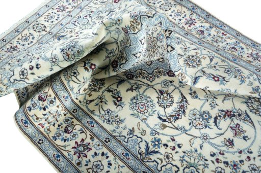 Surface texture of 2000s Nain rug with natural Wool and intricate pattern