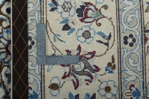Backside of handmade 2000s Nain rug showing knot structure and weave density