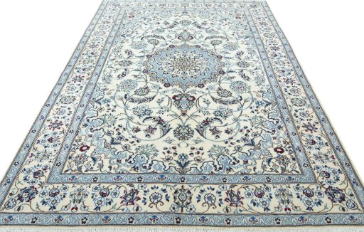 Surface texture of 2000s Nain rug with natural Wool and intricate pattern