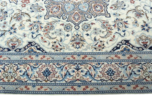 Corner detail of New Nain rug showing border pattern and Wool pile