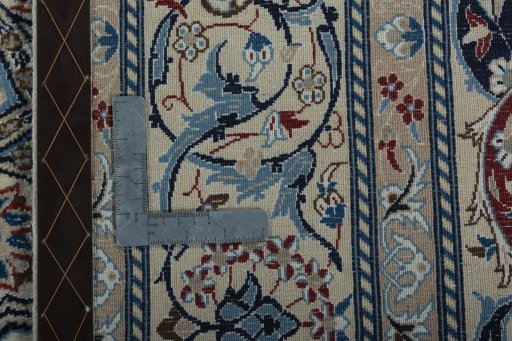Backside of handmade New Nain rug showing knot structure and weave density