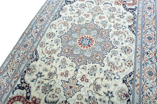 Backside of handmade New Nain rug showing knot structure and weave density