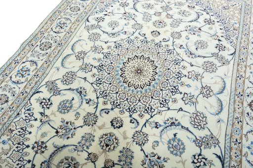 Backside of handmade New Nain rug showing knot structure and weave density