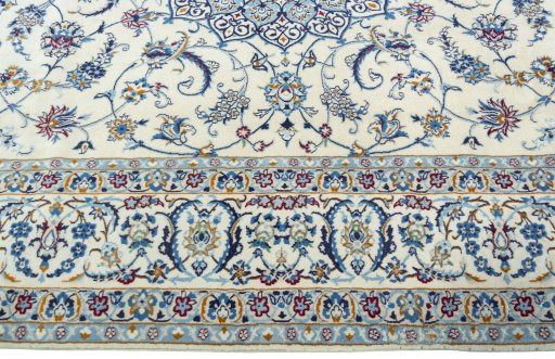 Corner detail of 2000s Nain rug showing border pattern and Wool pile