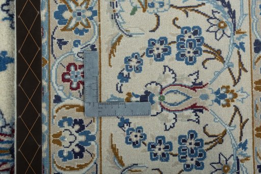 Backside of handmade 2000s Nain rug showing knot structure and weave density