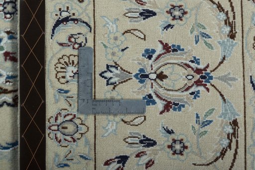 Backside of handmade New Nain rug showing knot structure and weave density