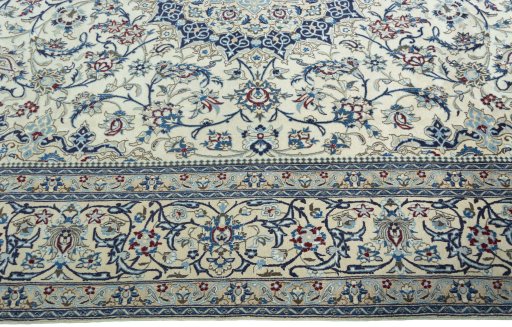 Corner detail of 2000s Nain rug showing border pattern and Wool pile
