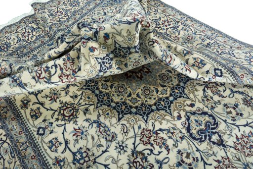 Surface texture of 2000s Nain rug with natural Wool and intricate pattern