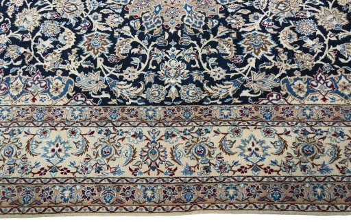 Corner detail of 2000s Nain rug showing border pattern and Wool pile