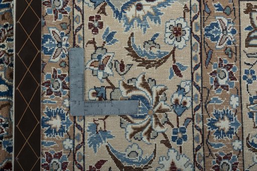 Backside of handmade 2000s Nain rug showing knot structure and weave density