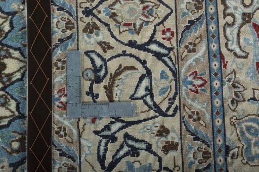 Backside of handmade Unknown Nain rug showing knot structure and weave density