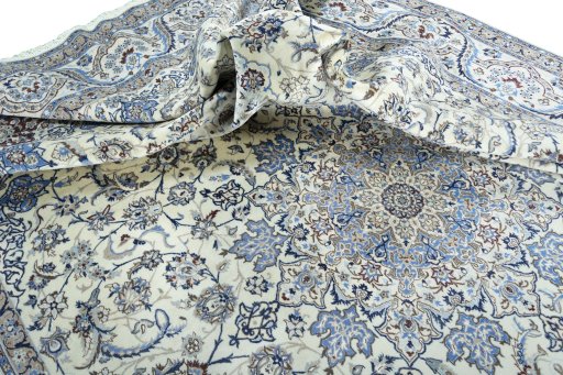 Surface texture of 2000s Nain rug with natural Wool and intricate pattern