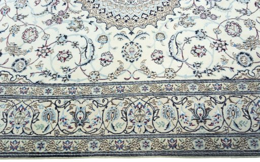 Corner detail of 2000s Nain rug showing border pattern and Wool pile