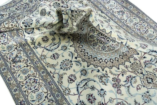 Surface texture of 2000s Nain rug with natural Wool and intricate pattern