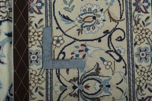 Backside of handmade 2000s Nain rug showing knot structure and weave density