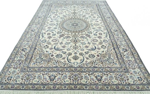 Surface texture of 2000s Nain rug with natural Wool and intricate pattern