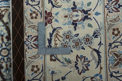 Backside of handmade New Nain rug showing knot structure and weave density