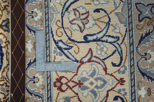 Backside of handmade Unknown Nain rug showing knot structure and weave density