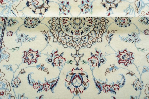 Corner detail of 2000s Nain rug showing border pattern and Wool pile