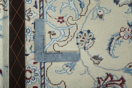 Surface texture of 2000s Nain rug with natural Wool and intricate pattern