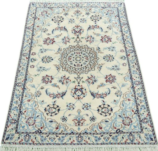 Surface texture of 2000s Nain rug with natural Wool and intricate pattern
