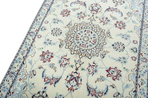 Backside of handmade 2000s Nain rug showing knot structure and weave density