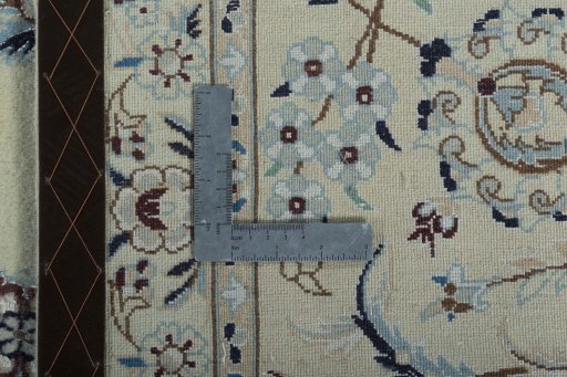 Backside of handmade New Nain rug showing knot structure and weave density