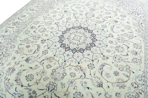 Backside of handmade New Nain rug showing knot structure and weave density