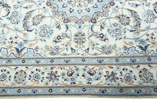 Corner detail of 2000s Nain rug showing border pattern and Wool pile