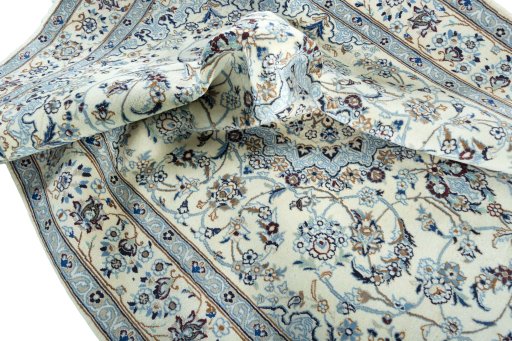 Surface texture of 2000s Nain rug with natural Wool and intricate pattern