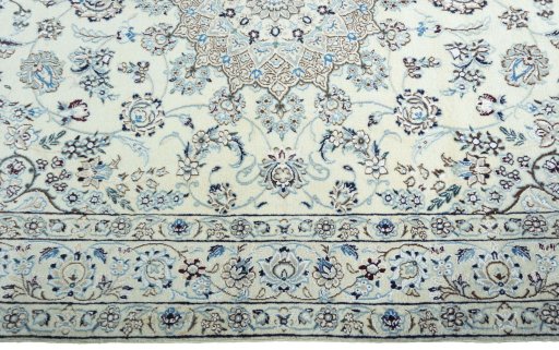 Corner detail of 2000s Nain rug showing border pattern and Wool pile
