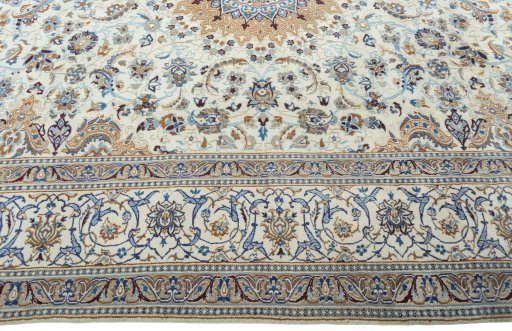 Corner detail of 2000s Nain rug showing border pattern and Wool pile