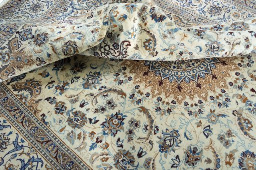Surface texture of 2000s Nain rug with natural Wool and intricate pattern