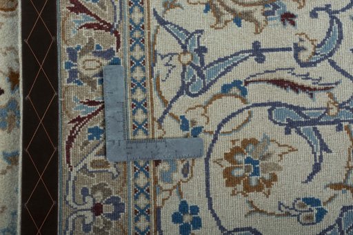 Backside of handmade 2000s Nain rug showing knot structure and weave density