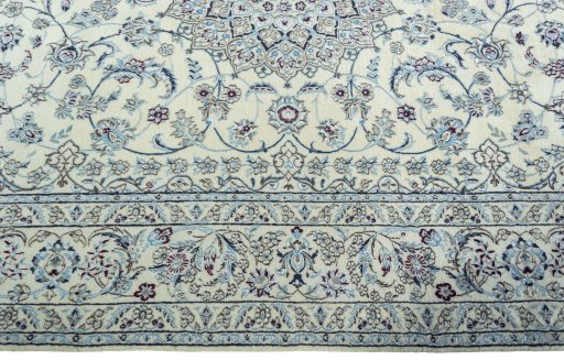 Corner detail of 2000s Nain rug showing border pattern and Wool pile