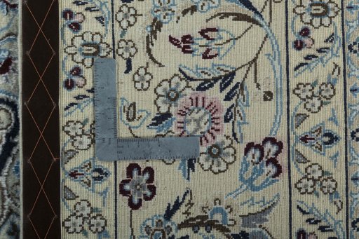 Backside of handmade 2000s Nain rug showing knot structure and weave density