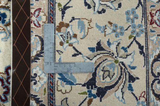 Backside of handmade 2000s Nain rug showing knot structure and weave density