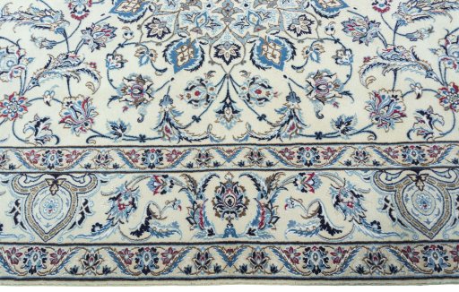 Corner detail of 2000s Nain rug showing border pattern and Wool pile