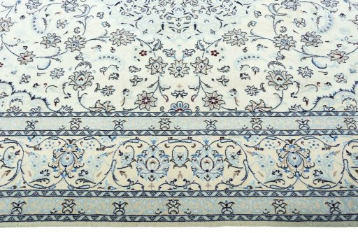 Corner detail of 2000s Nain rug showing border pattern and Wool pile