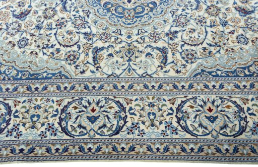 Corner detail of 2000s Nain rug showing border pattern and Wool pile